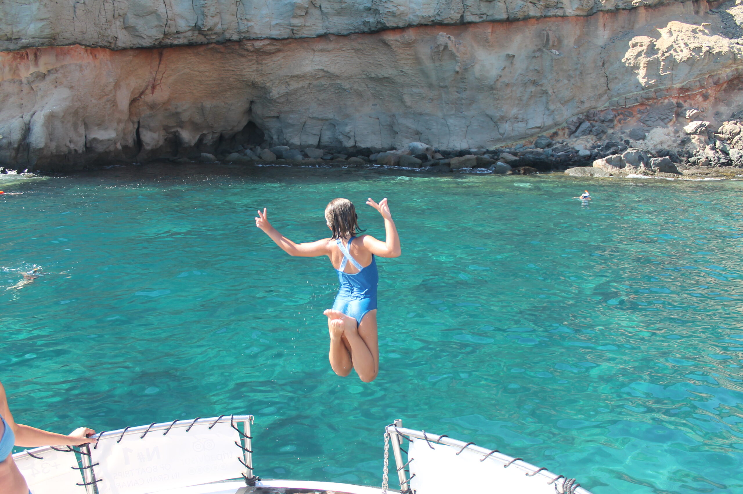 Child Jumping into the Sea from Yellow Boat Mogan – Fun Family Excursion